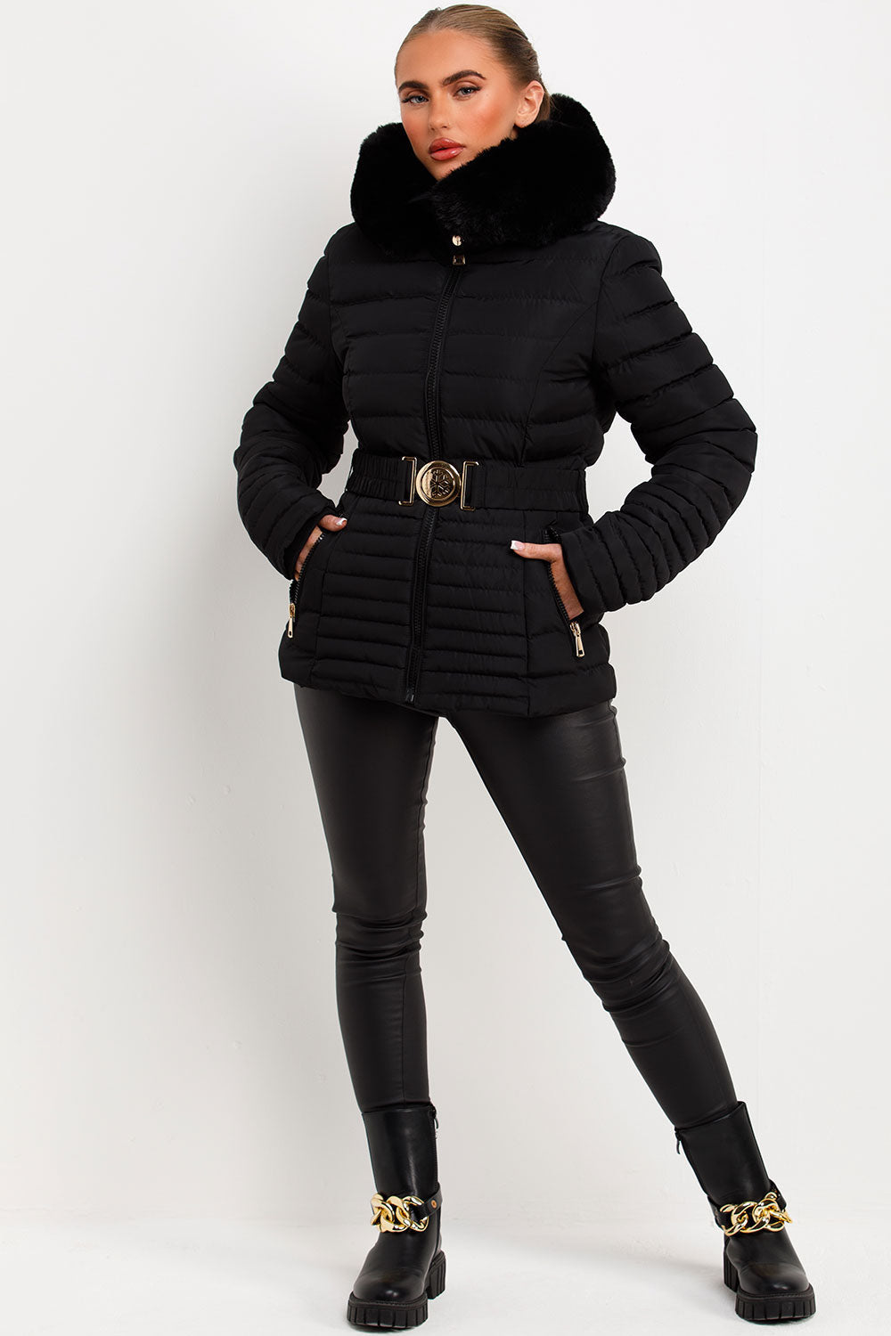 Black Puffer Jacket With Faux Fur Hood And Gold Belt