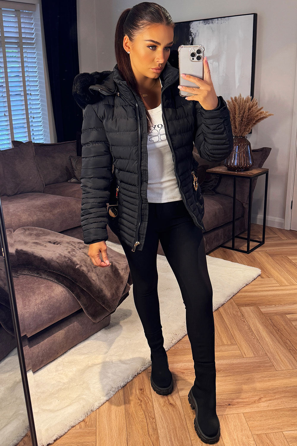 Black Puffer Jacket With Faux Fur Hood And Gold Belt