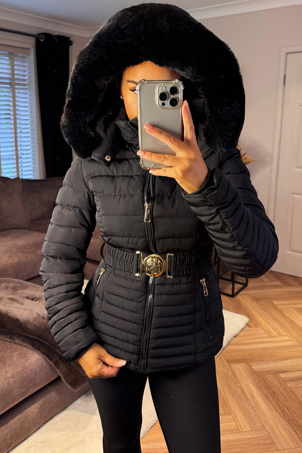 Black Puffer Jacket With Faux Fur Hood And Gold Belt