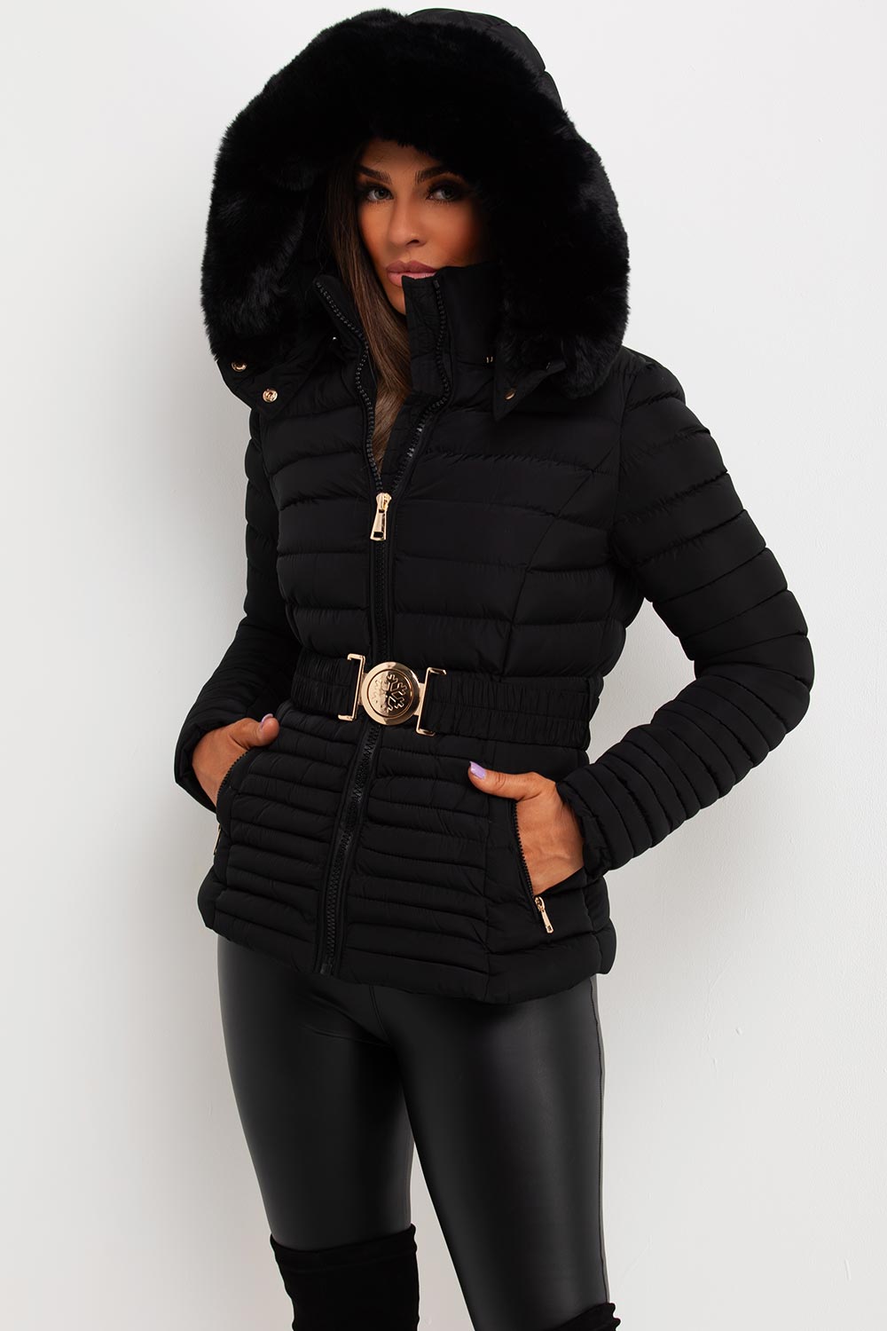 Black Puffer Jacket With Faux Fur Hood And Gold Belt