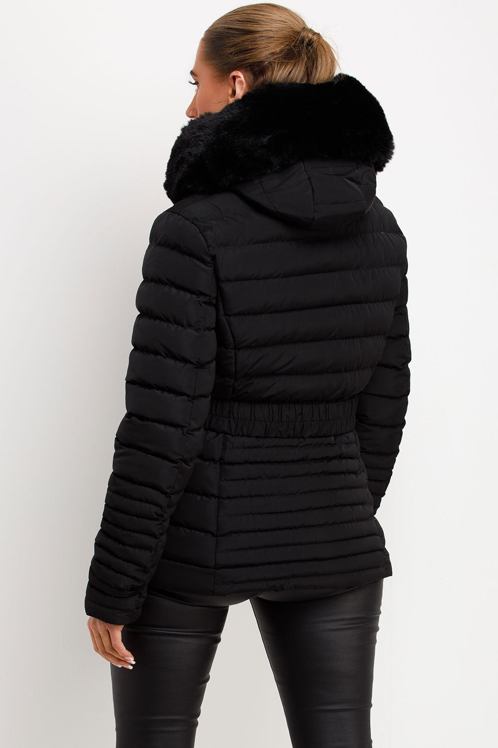 Black Puffer Jacket With Faux Fur Hood And Gold Belt