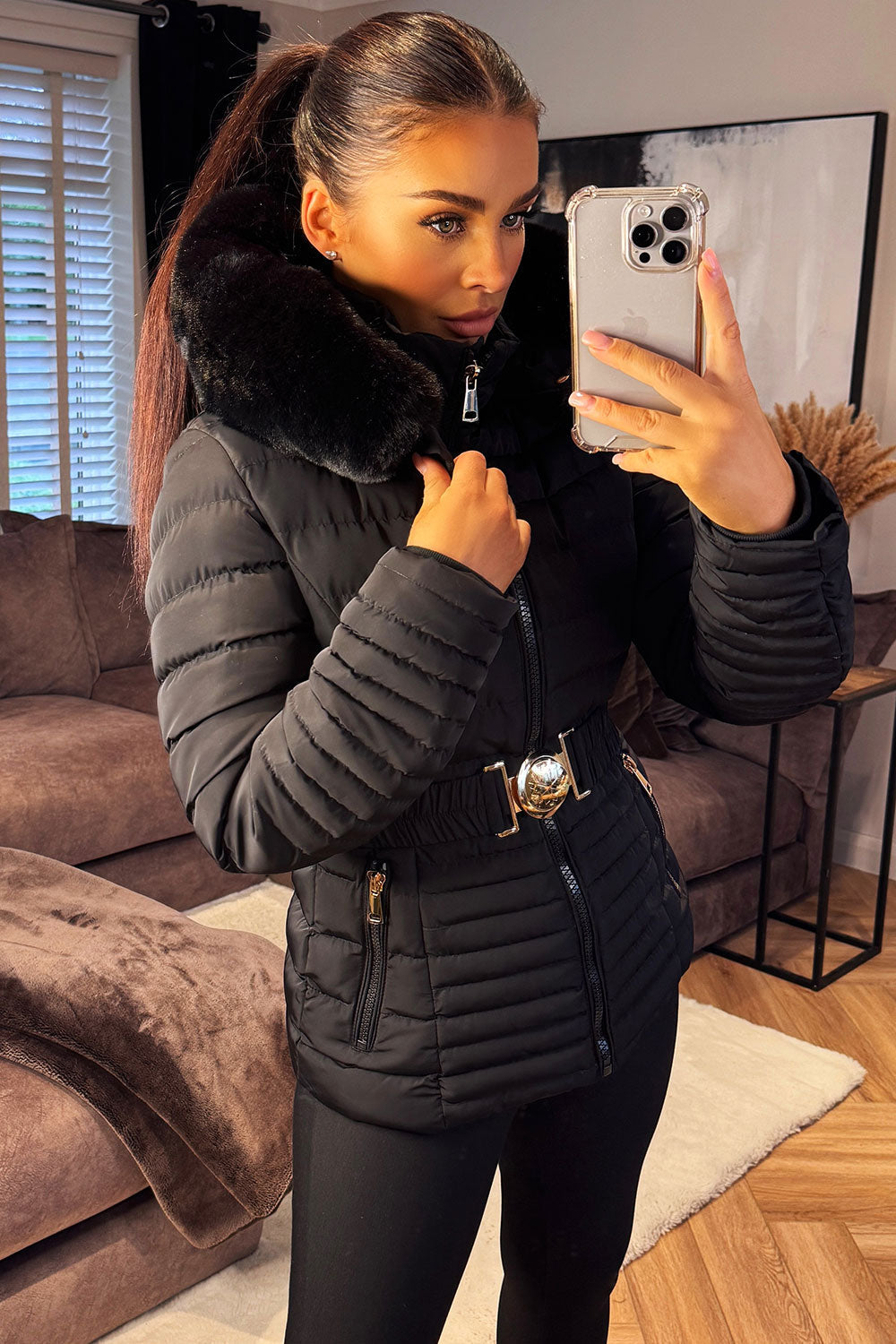 Black Puffer Jacket With Faux Fur Hood And Gold Belt