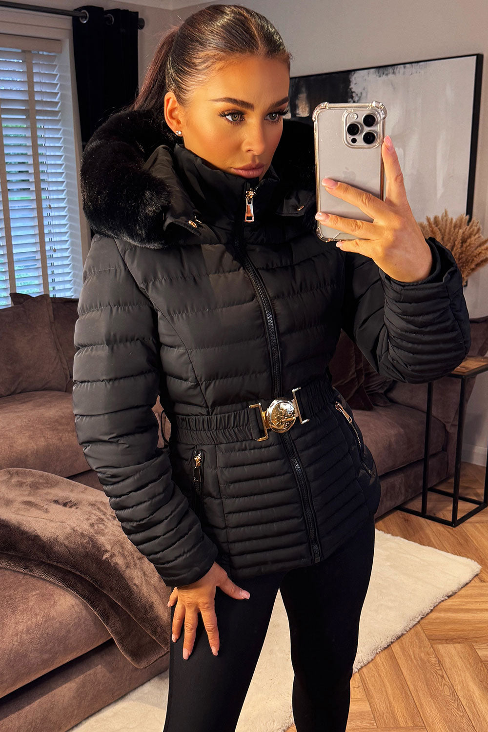 Black Puffer Jacket With Faux Fur Hood And Gold Belt