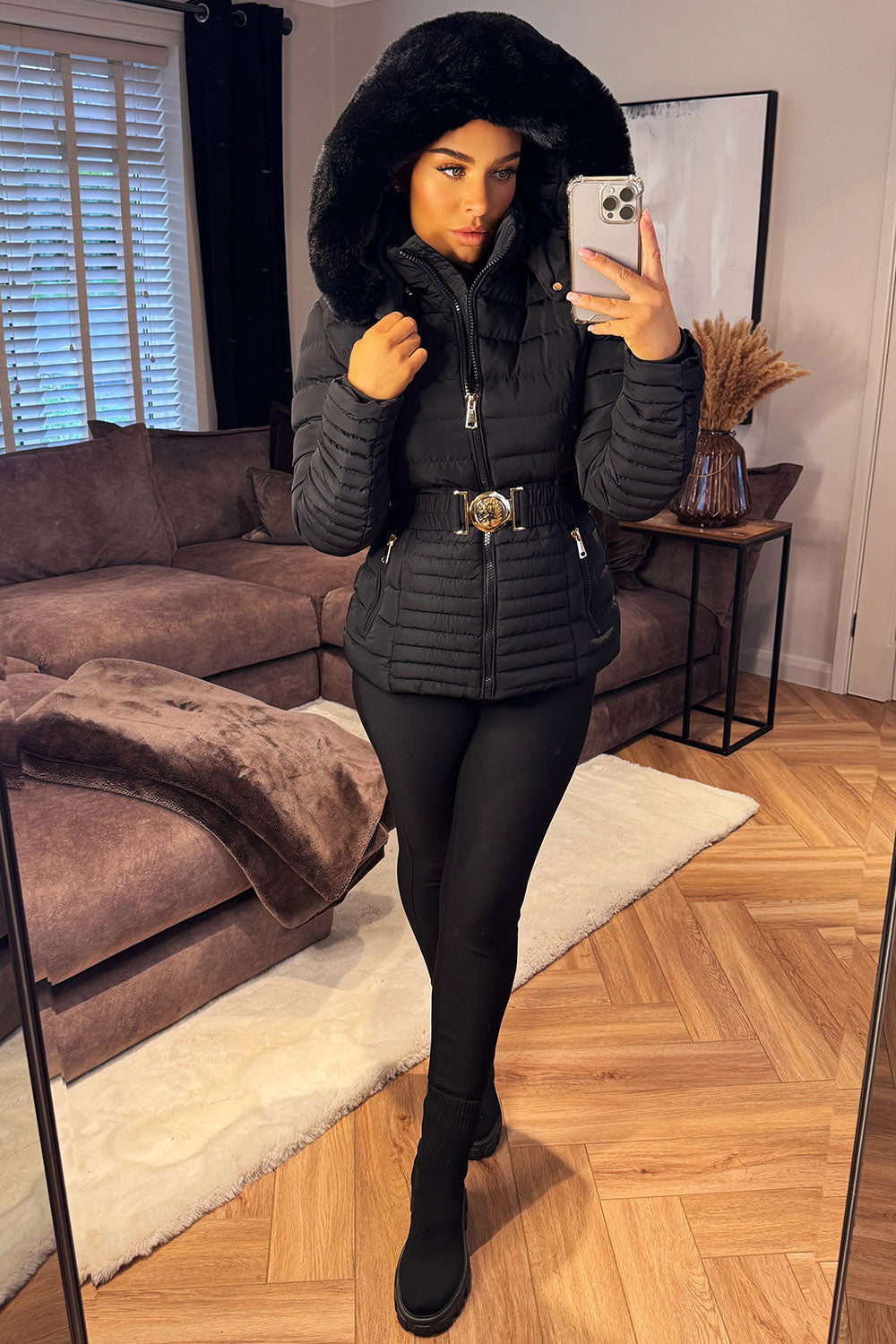 Black Puffer Jacket With Faux Fur Hood And Gold Belt