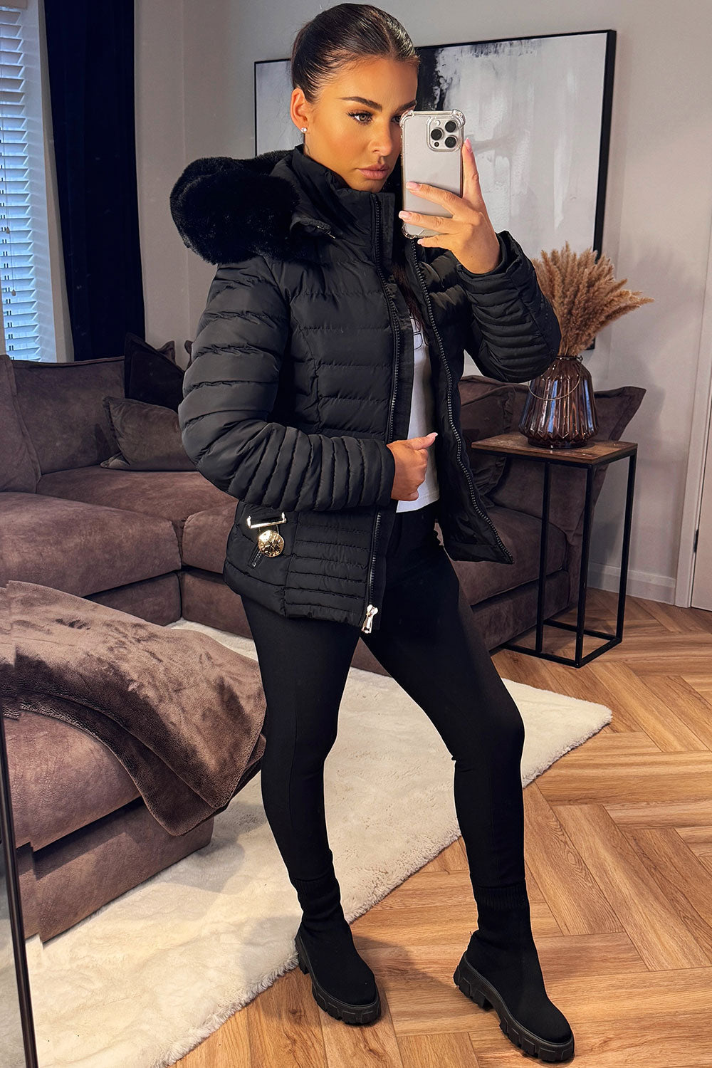 Black Puffer Jacket With Faux Fur Hood And Gold Belt