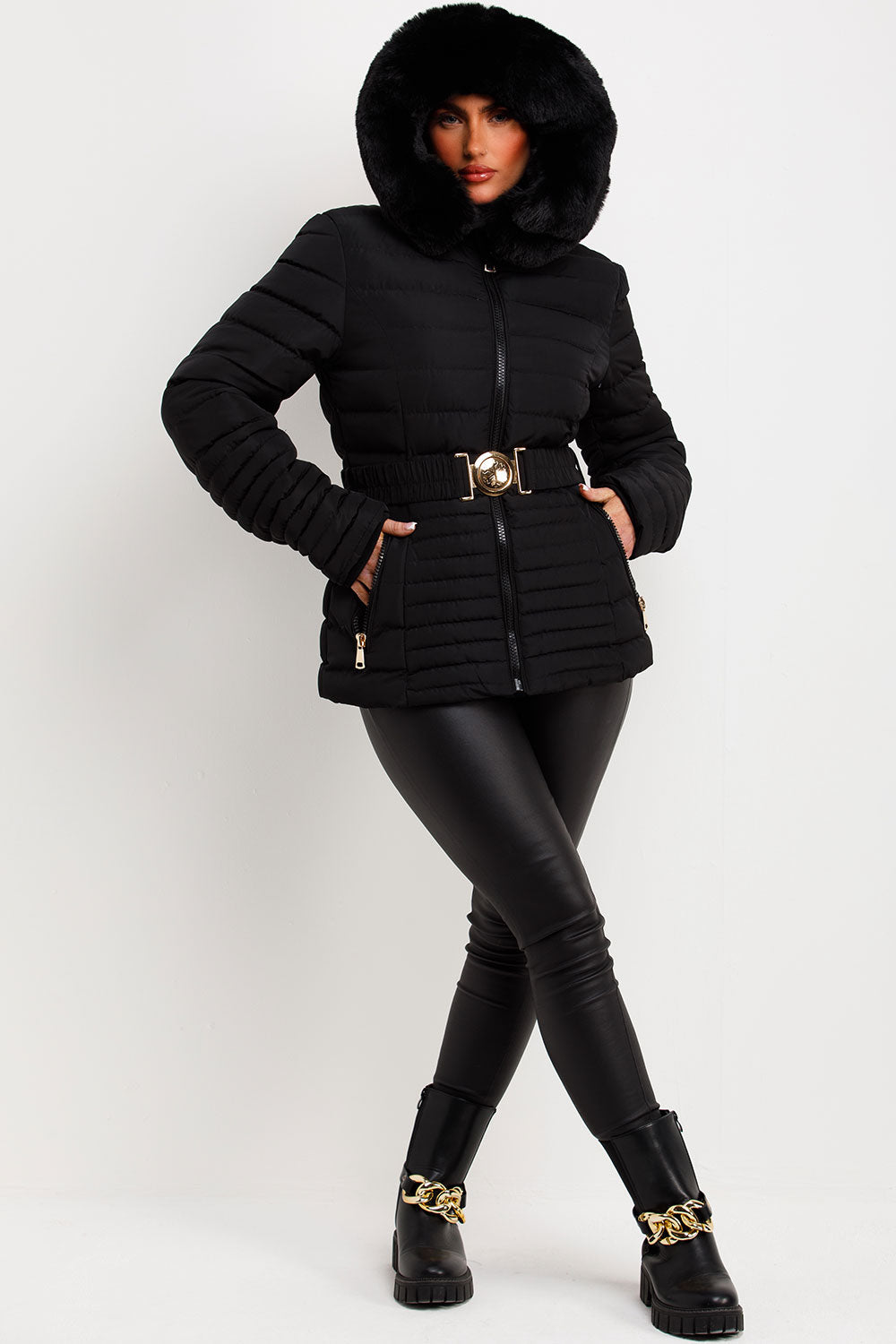 Black Puffer Jacket With Faux Fur Hood And Gold Belt