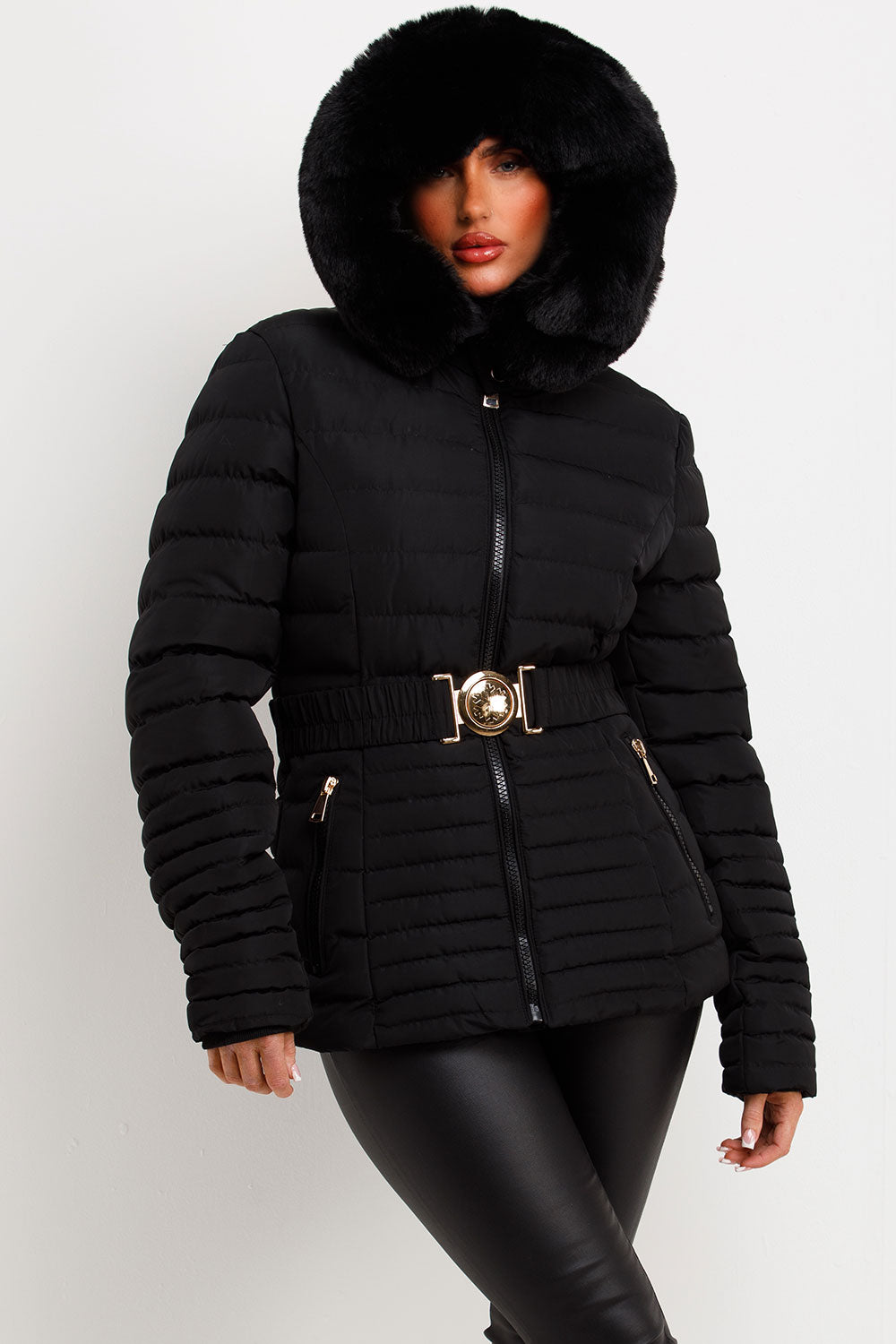 Black Puffer Jacket With Faux Fur Hood And Gold Belt