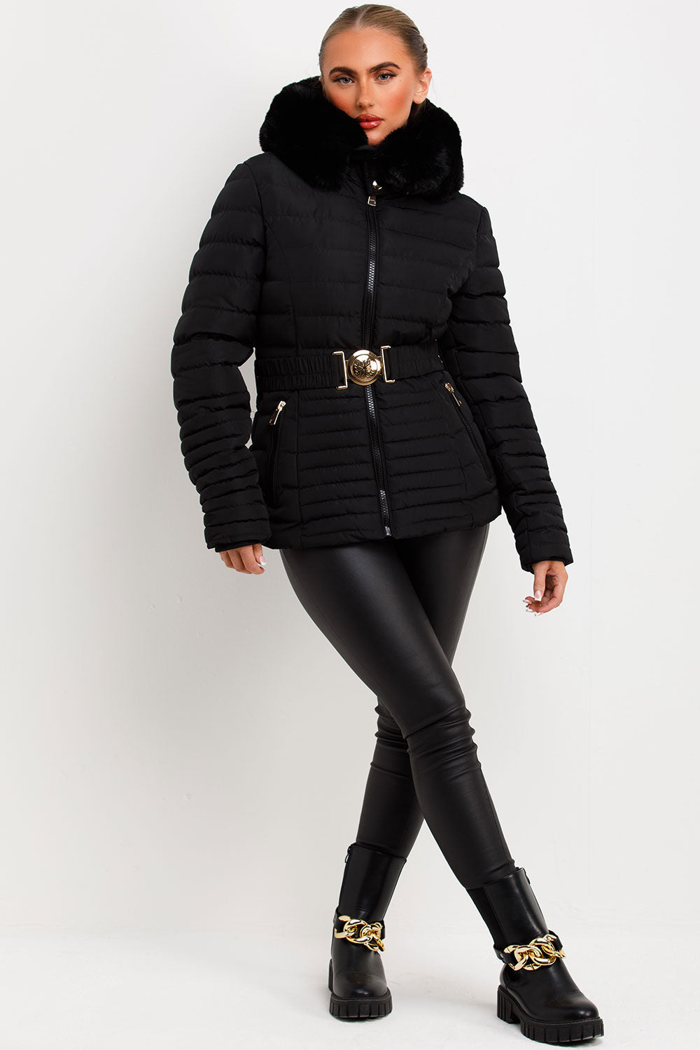 Black Puffer Jacket With Faux Fur Hood And Gold Belt