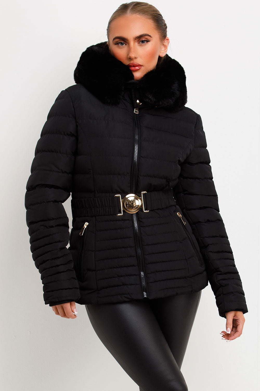 Black Puffer Jacket With Faux Fur Hood And Gold Belt