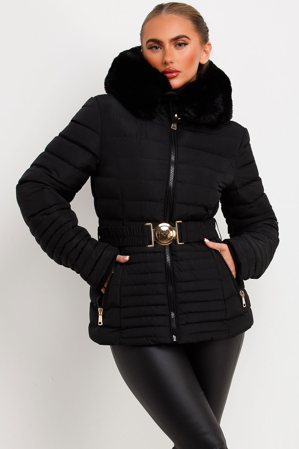 Black Puffer Jacket With Faux Fur Hood And Gold Belt