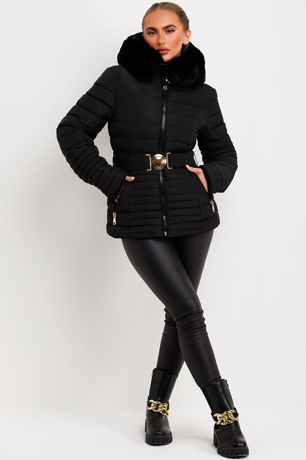 Black Puffer Jacket With Faux Fur Hood And Gold Belt