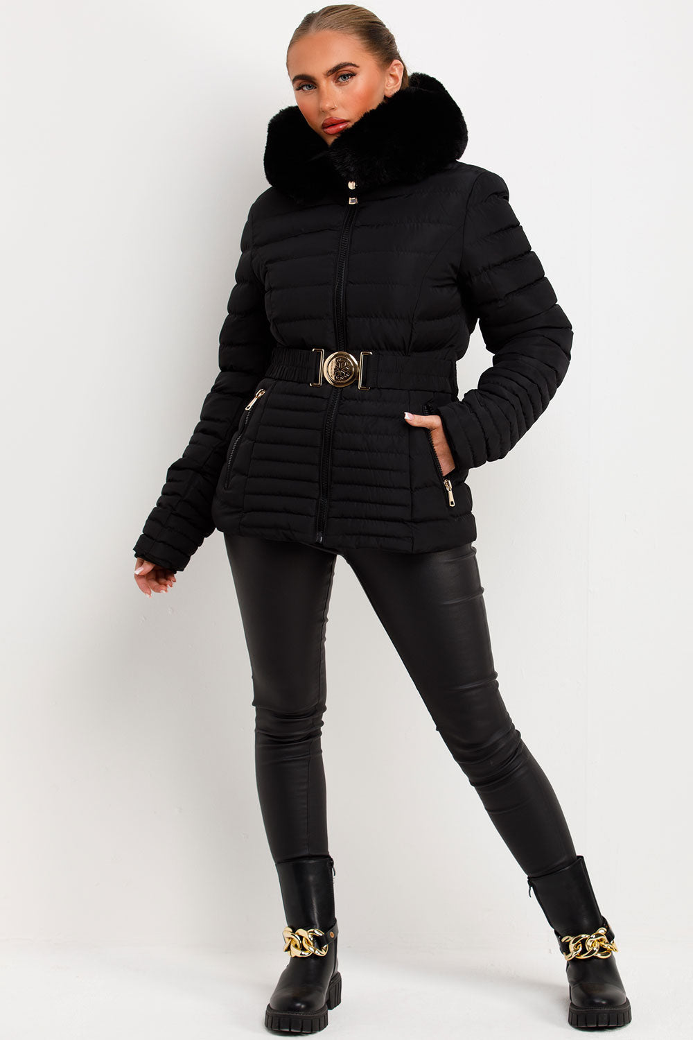 Black Puffer Jacket With Faux Fur Hood And Gold Belt